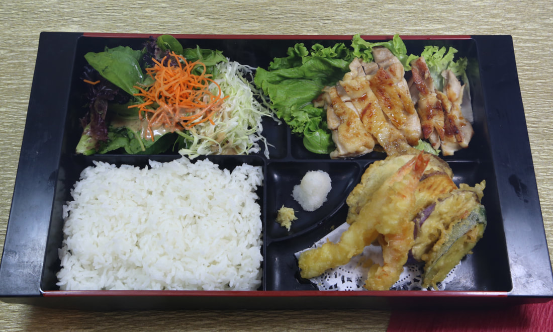 Lunch combination bento with chicken teriyaki, karaage, and shrimp tempura